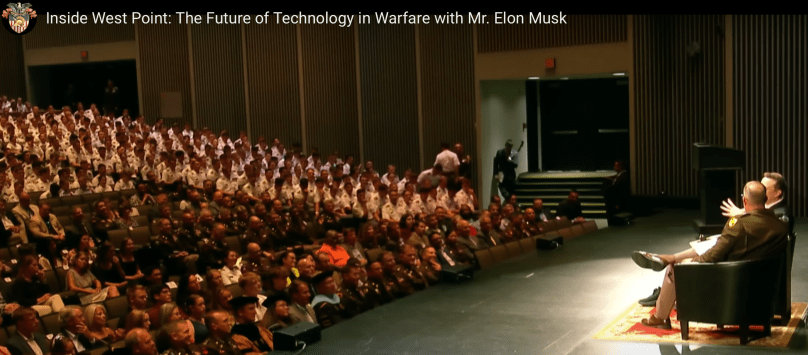 A primarily young audience of students gather to intently listen to Elon Musk at West Point. Elon spoke at on August 16, 2024, during a fireside chat with Brigadier General Shane Reeves, as part of the U.S. Military Academy’s convocation.