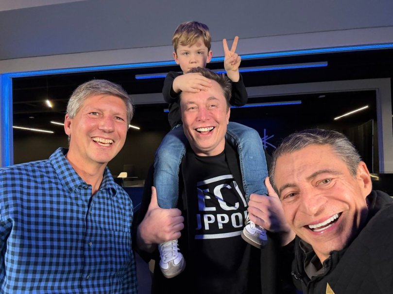 Dave Blundin, Lil X, Elon Musk, Peter Diamandes, in a photo posted to X on January 6, 2026. Taken in the lobby of Giga Texas.