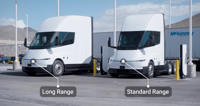 In sleek Art Deco symmetry, the Long Range and Standard Range Tesla Semi stand side-by-side at the charging station — two elegant expressions of power and efficiency. With deepest respect to Elon Musk’s visionary design, this refined scene from Ashlee Vance’s Core Memory factory tour reveals Tesla offering both variants to meet diverse fleet needs and price points, bringing the electric trucking revolution ever closer.