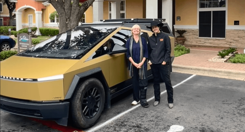 Gail Alfar and Captain Eli in-car on Tesla Full Self-Driving FSD – Episode 166 Gail’s Tesla Podcast – discussing supporting Elon Musk on X, staying current, and his new clothing line in Austin