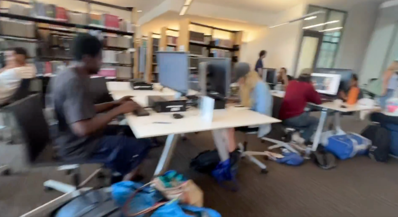Inside the Austin Public Library computer area. Look at all the luggage and personal belongings piled around the desks and on the floor. This doesn’t feel like a public library anymore — it feels eerie, crowded, and unsafe. Families and regular patrons are clearly not the priority here.